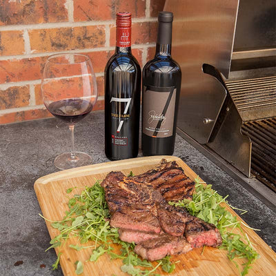 Porcini Rubbed Ribeye Steaks over Arugula